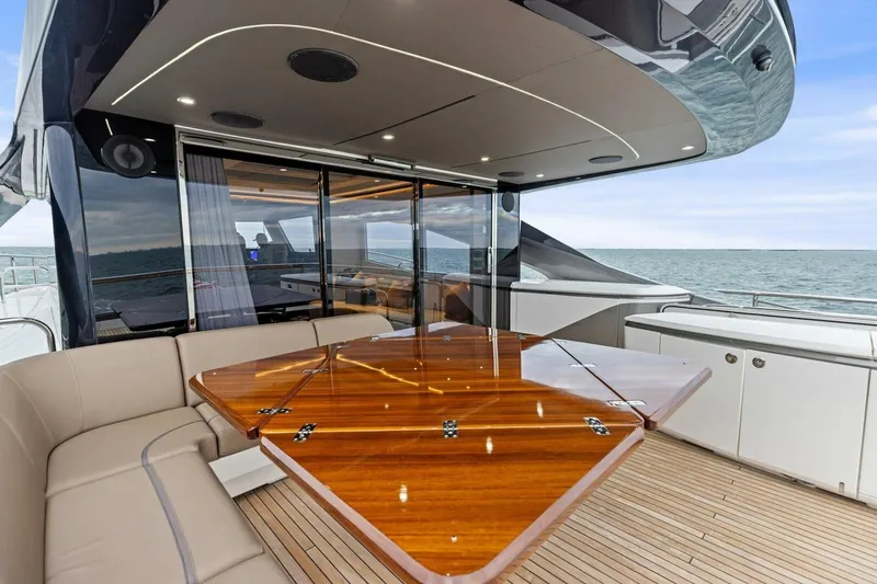 Slide: The Image of Luxurious 2024 Princess X80 yacht deck with elegant seating and ocean view. - 107