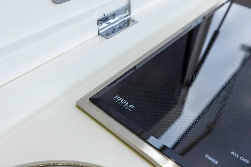 Slide: The Image of Modern Wolf induction cooktop on 2024 Princess X80 yacht kitchen. - 111