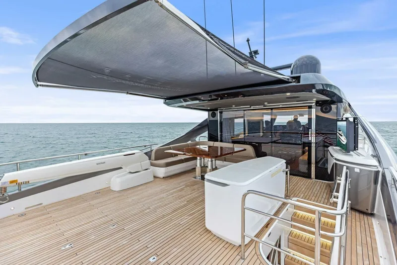 Slide: The Image of Luxurious 2024 Princess X80 yacht deck with seating, ocean view, and modern amenities. - 113