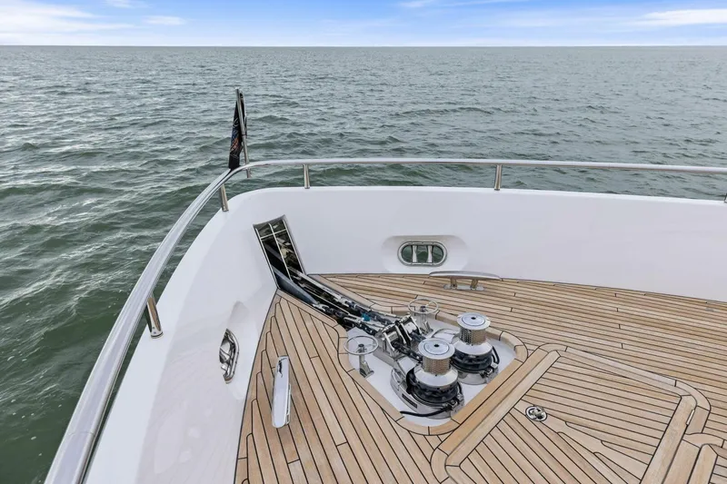 Slide: The Image of Bow of 2024 Princess X80 yacht with teak deck and ocean view. - 116