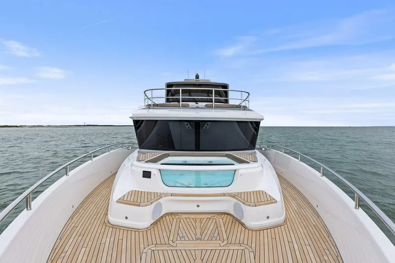 Slide: The Image of 2024 Princess X80 yacht with spacious deck and luxurious design on open water. - 119