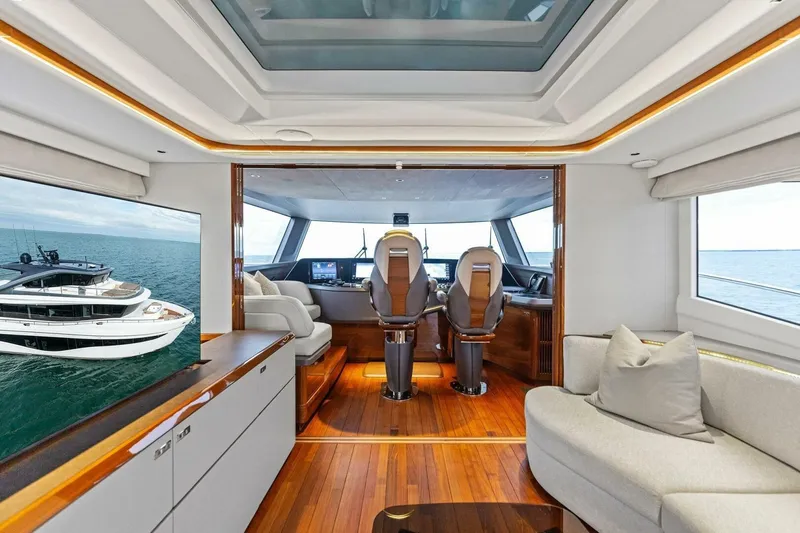 Slide: The Image of Luxurious interior of 2024 Princess X80 yacht with modern helm and seating area. - 12