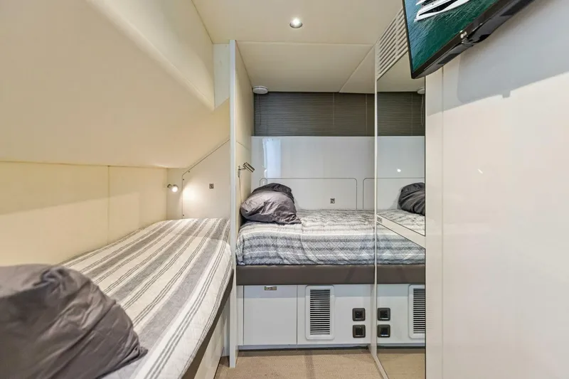 Slide: The Image of Luxurious cabin interior of 2024 Princess X80 yacht with modern bedding and sleek design. - 121