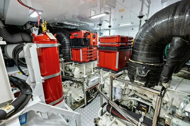 Slide: The Image of Engine room of 2024 Princess X80 yacht with red equipment and fire extinguisher. - 134
