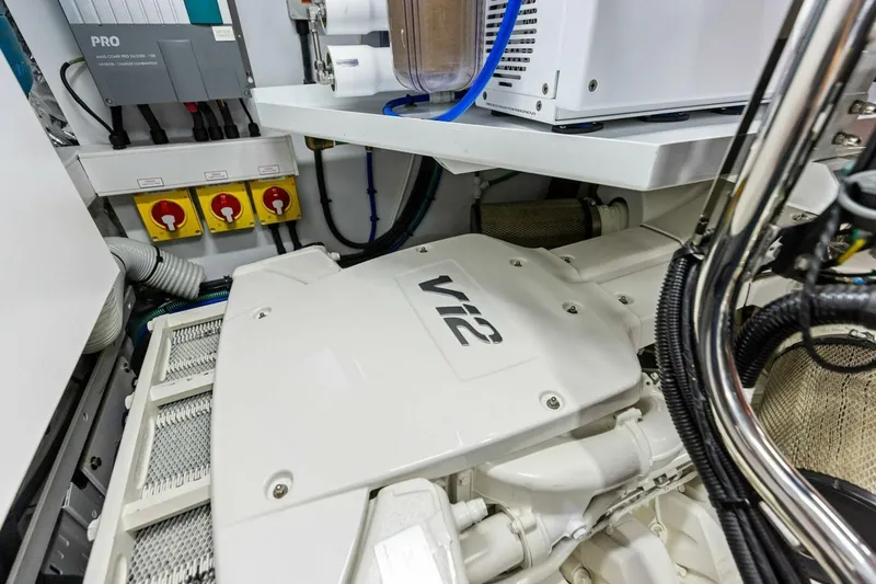 Slide: The Image of Engine room of 2024 Princess X80 yacht featuring a V12 engine. - 136