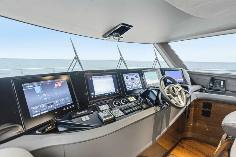 Slide: The Image of 2024 Princess X80 yacht cockpit with advanced navigation systems and luxurious interior design. - 14