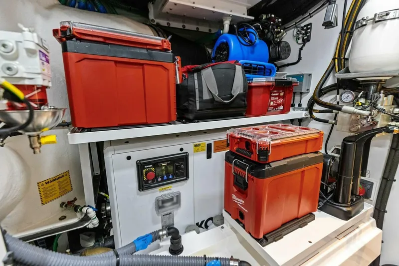Slide: The Image of Engine room of 2024 Princess X80 yacht with red toolboxes and equipment. - 142