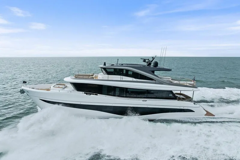 Slide: The Image of 2024 Princess X80 yacht cruising on open sea under clear blue sky. - 145