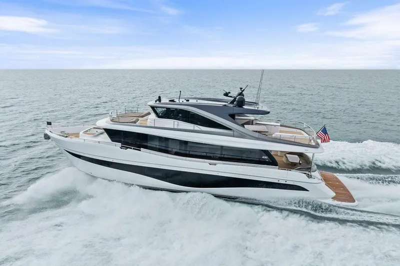 Slide: The Image of 2024 Princess X80 yacht cruising on open sea with American flag. - 148