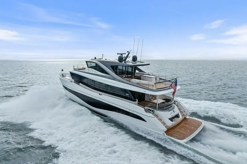 Slide: The Image of 2024 Princess X80 yacht cruising on open sea under clear blue sky. - 149