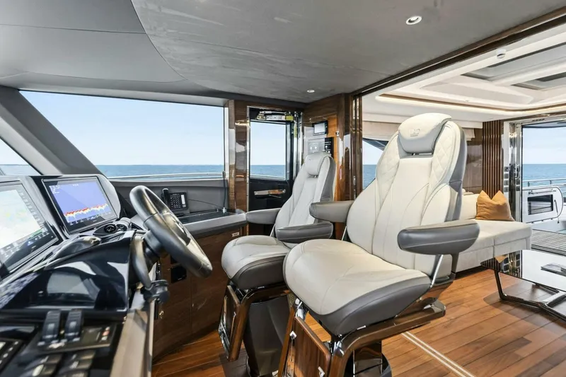 Slide: The Image of Luxurious interior of 2024 Princess X80 yacht with modern helm and plush seating. - 15