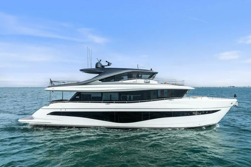 Slide: The Image of 2024 Princess X80 yacht cruising on open water under a clear blue sky. - 159