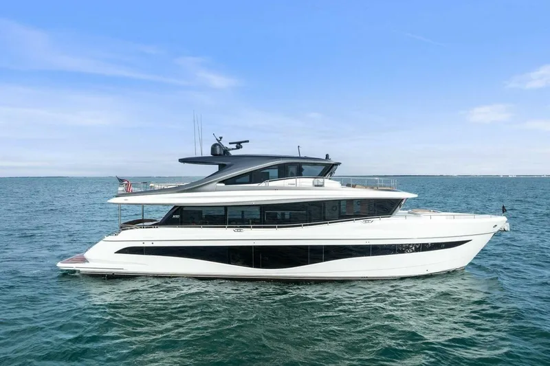Slide: The Image of 2024 Princess X80 yacht cruising on open water under a clear blue sky. - 163