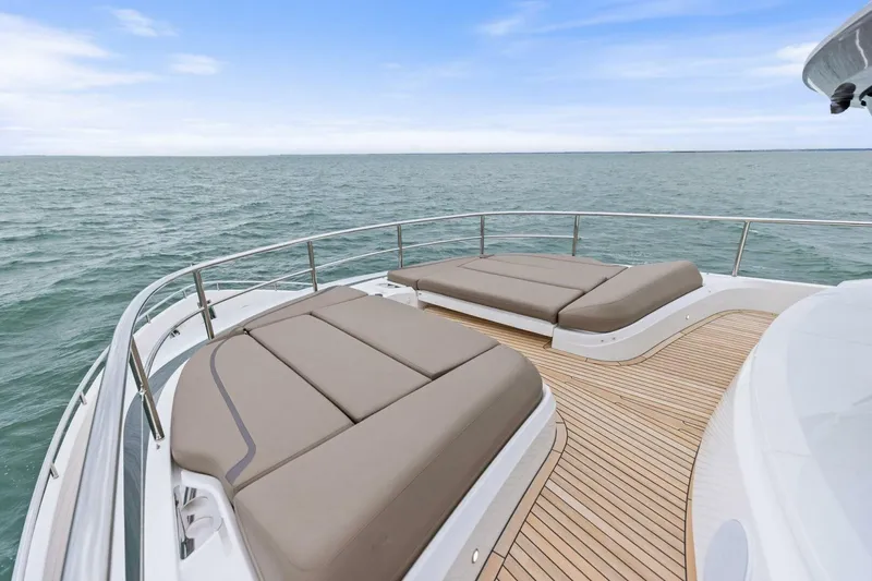 Slide: The Image of Luxurious 2024 Princess X80 yacht deck with sun loungers overlooking the ocean. - 20