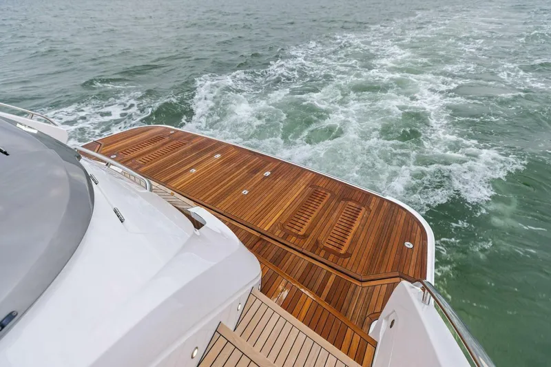 Slide: The Image of Luxury yacht Princess X80 2024 with elegant wooden deck cruising on open water. - 22