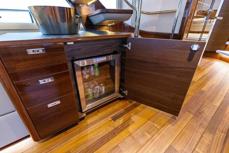 Slide: The Image of Luxurious 2024 Princess X80 yacht interior with minibar and elegant wood finish. - 31