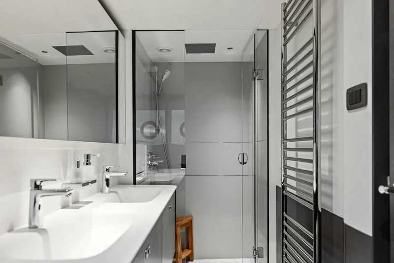 Slide: The Image of Modern bathroom in 2024 Princess X80 yacht with sleek fixtures and glass shower. - 46