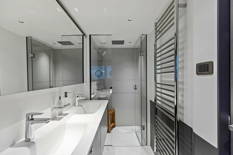 Slide: The Image of Luxurious bathroom in 2024 Princess X80 yacht with modern fixtures and glass shower. - 47