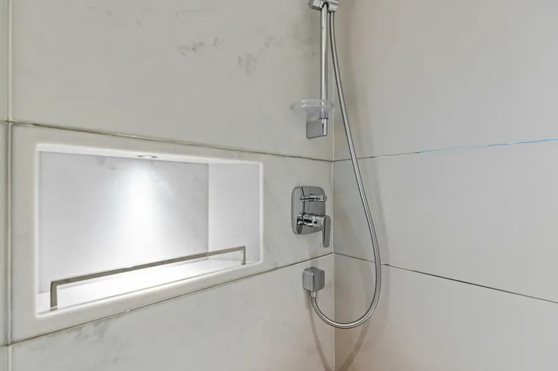 Slide: The Image of Modern shower with chrome fixtures in 2024 Princess X80 yacht bathroom. - 48