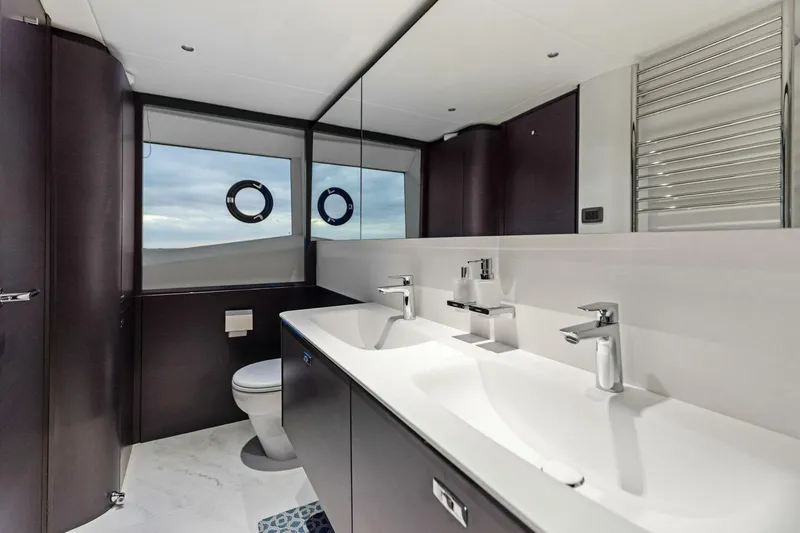Slide: The Image of Luxurious bathroom in 2024 Princess X80 yacht with dual sinks and modern fixtures. - 50