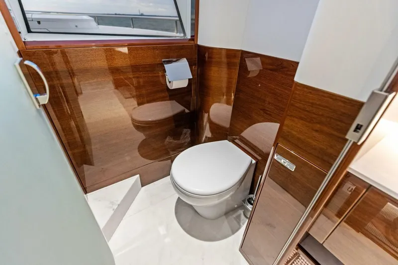 Slide: The Image of Luxurious bathroom in 2024 Princess X80 yacht with wooden paneling and modern fixtures. - 58