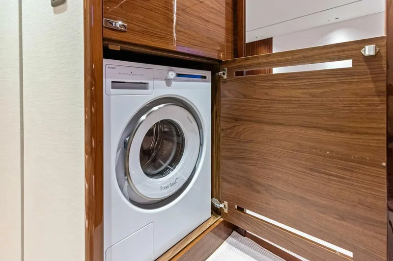 Slide: The Image of Built-in washing machine in 2024 Princess X80 yacht's wooden cabinet. - 62