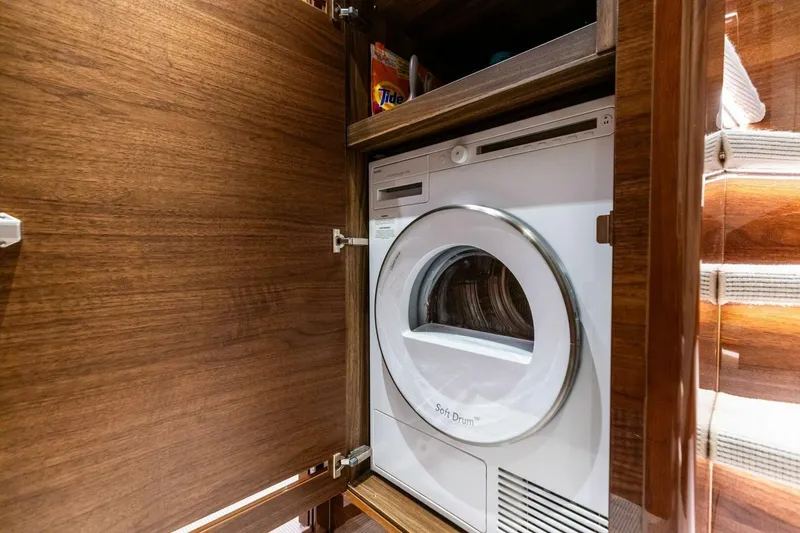 Slide: The Image of Built-in washing machine in 2024 Princess X80 yacht's wooden cabinet. - 63