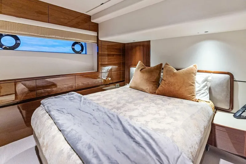 Slide: The Image of Luxurious bedroom interior of 2024 Princess X80 yacht with elegant bedding and wood accents. - 64