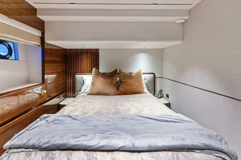 Slide: The Image of Luxurious bedroom interior of 2024 Princess X80 yacht with elegant bedding and wood accents. - 65