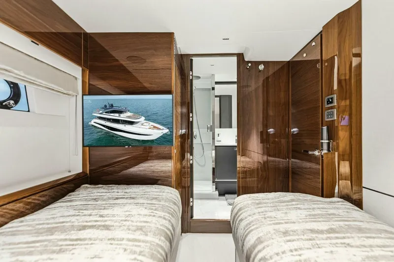 Slide: The Image of Luxurious 2024 Princess X80 yacht cabin with twin beds and modern amenities. - 70