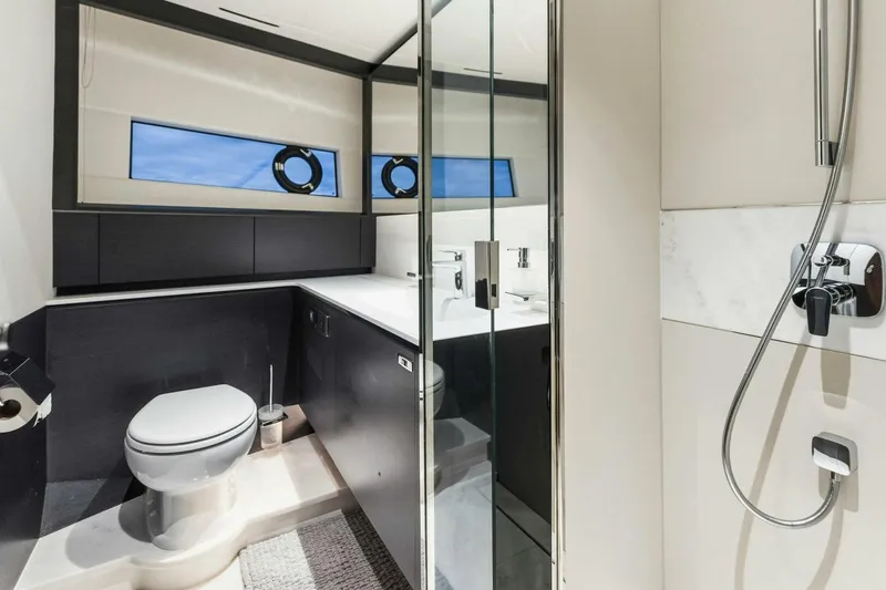 Slide: The Image of Luxurious bathroom in 2024 Princess X80 yacht with modern fixtures and sleek design. - 80