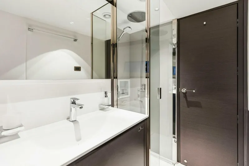 Slide: The Image of Luxurious bathroom in 2024 Princess X80 yacht with modern fixtures and glass shower. - 81