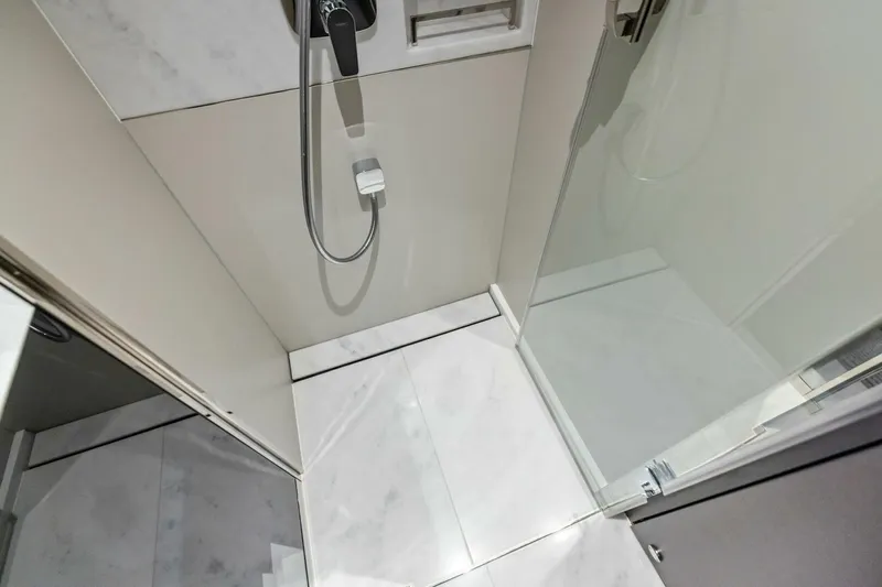 Slide: The Image of Modern shower area in 2024 Princess X80 yacht with sleek design and glass door. - 83