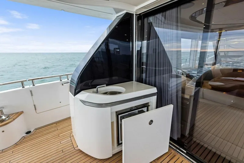 Slide: The Image of Luxurious 2024 Princess X80 yacht deck with sleek outdoor kitchenette and ocean view. - 91