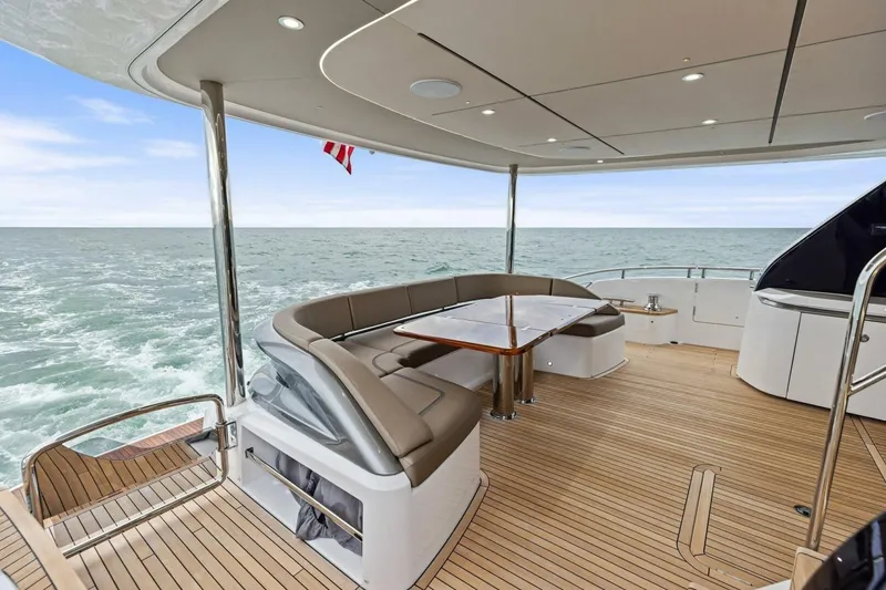 Slide: The Image of Luxurious 2024 Princess X80 yacht deck with elegant seating and ocean view. - 94
