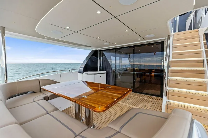 Slide: The Image of Luxurious 2024 Princess X80 yacht deck with elegant seating and ocean view. - 95