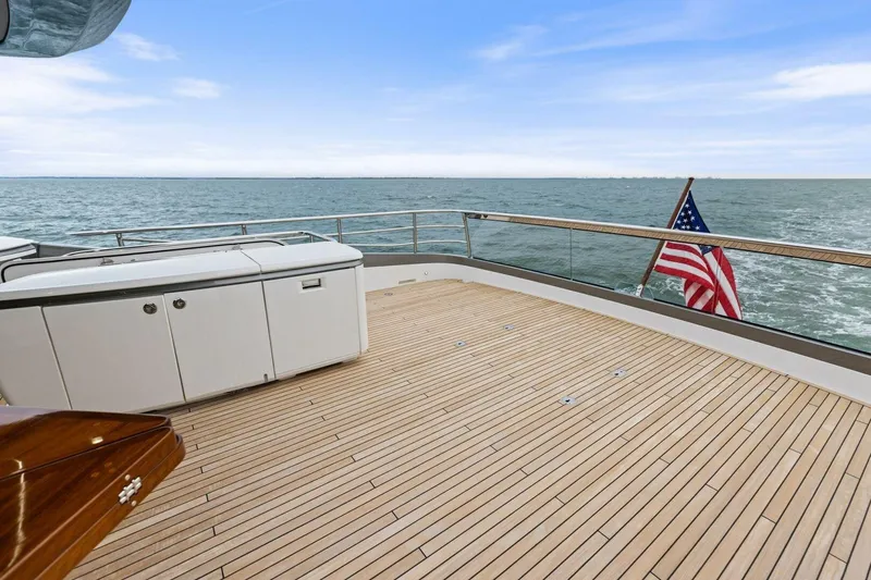 Slide: The Image of 2024 Princess X80 yacht deck with ocean view and American flag. - 98