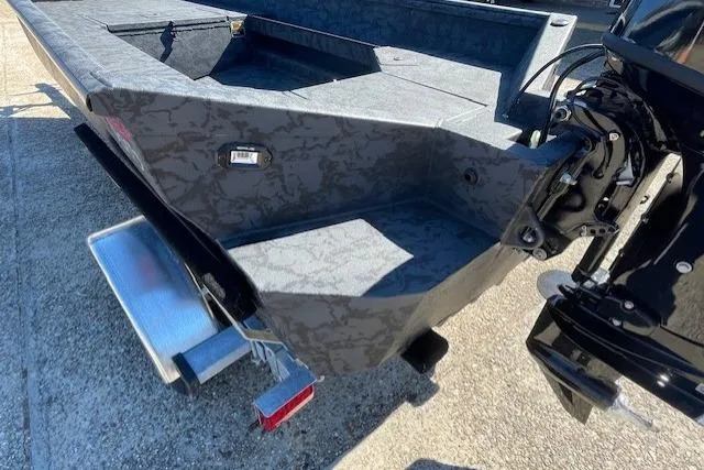 Slide: The Image of 2026 Reaper Boats 553-1689 model, rear view with motor and textured design. - 5