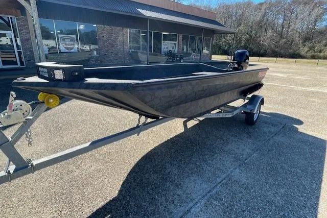 Slide: The Image of 2026 Reaper Boats 553-1689 model on trailer, parked outdoors near a building. - 8