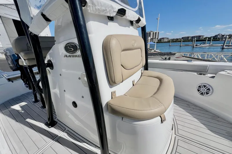 Slide: The Image of 2016 Sportsman Masters 247 Bay Boat interior with console and dock view. - 13