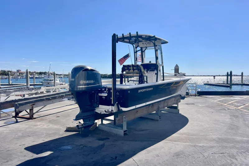 Slide: The Image of 2016 Sportsman Masters 247 Bay Boat on display at a marina. - 7