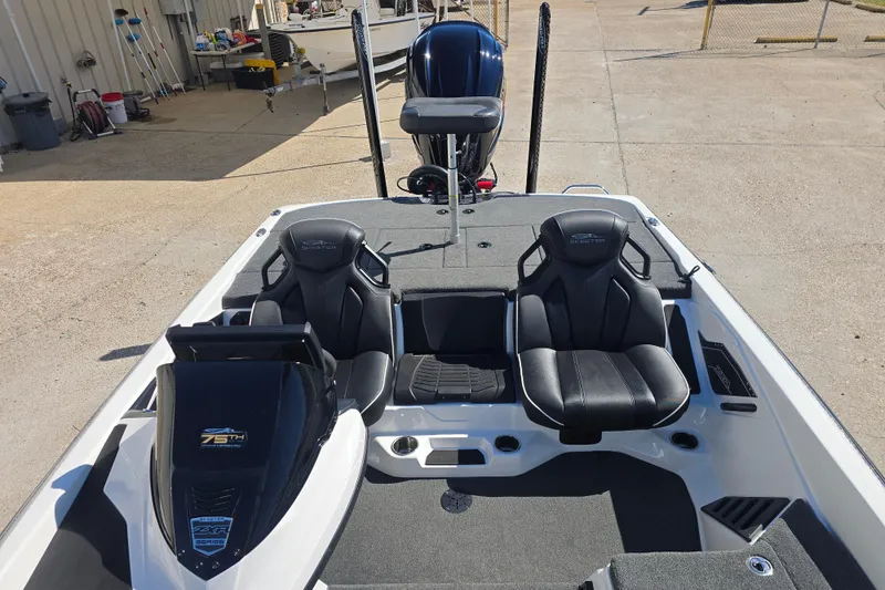 Slide: The Image of 2023 Skeeter ZXR19 boat interior with black seats and modern design. - 10