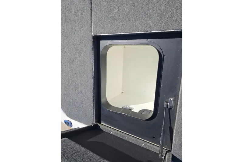 Slide: The Image of 2023 Skeeter ZXR19 boat storage compartment with open hatch, showcasing interior space. - 17