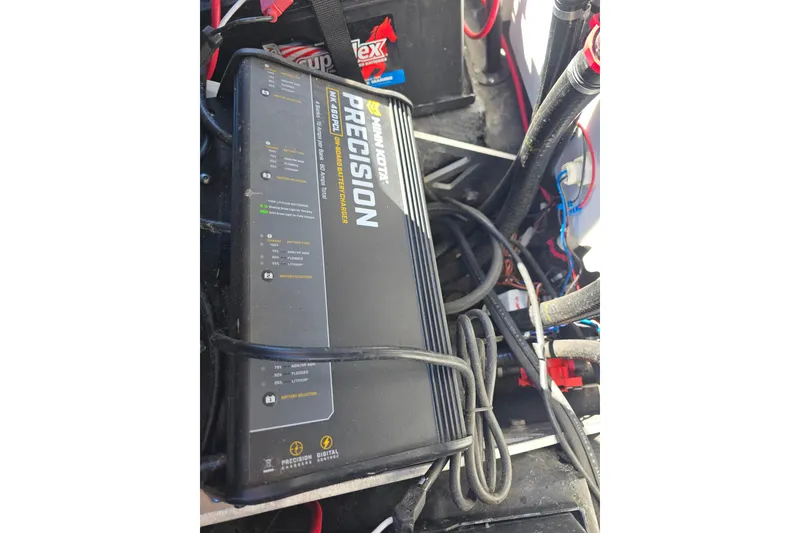 Slide: The Image of Minn Kota Precision onboard battery charger in a 2023 Skeeter ZXR19 boat. - 20