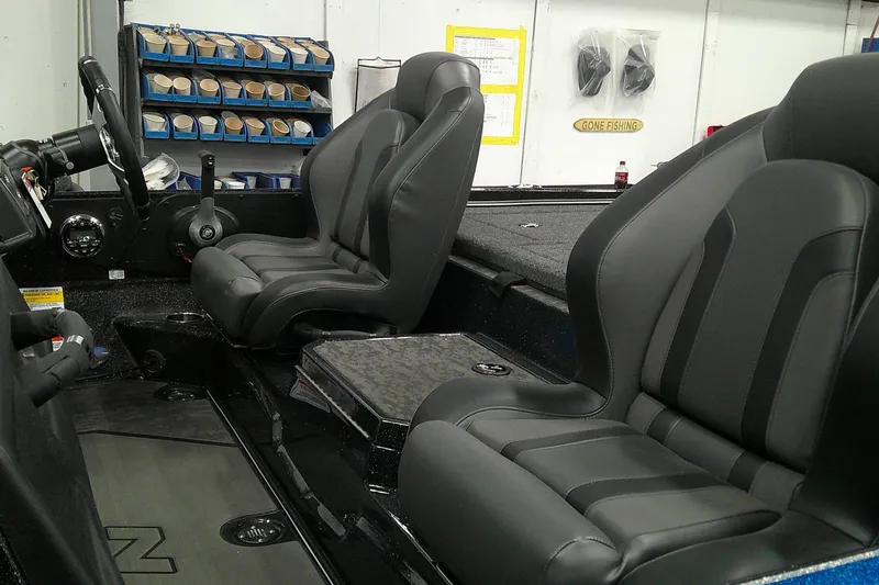 Slide: The Image of 2025 Nitro Z21 XL boat interior with sleek black seats and modern dashboard. - 4