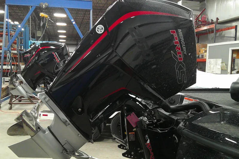 Slide: The Image of 2025 Nitro Z21 XL boat with Mercury Pro XS engines in a workshop setting. - 5