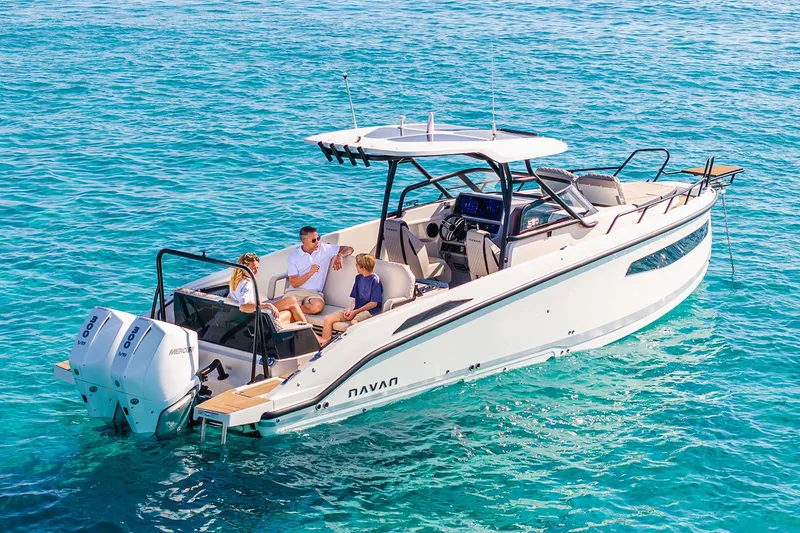 Slide: The Image of Manufacturer Provided Image: 2026 Navan S30 boat on clear blue water with passengers enjoying the ride. - 1