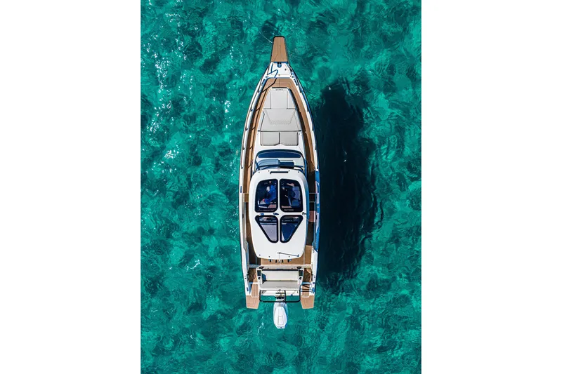 Slide: The Image of Aerial view of 2026 Navan S30 boat on clear turquoise water. - 10