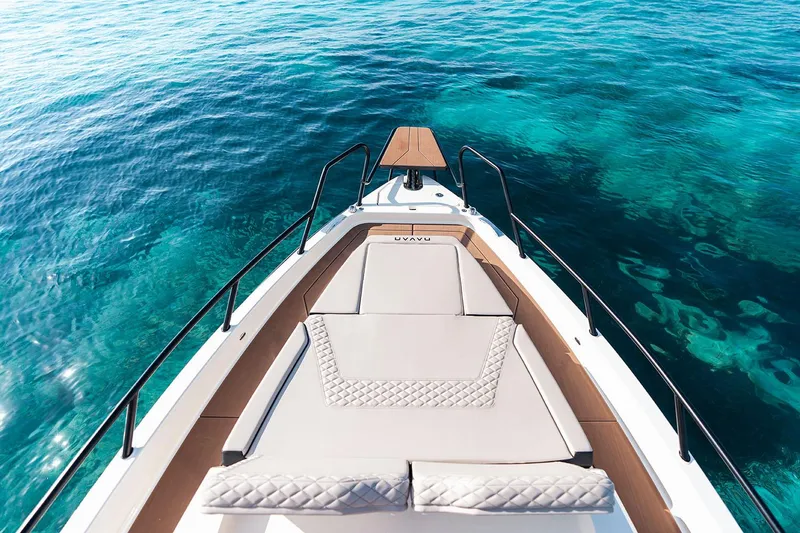 Slide: The Image of Manufacturer Provided Image: Navan S30 2026 boat on clear turquoise water, featuring a luxurious sun deck. - 5