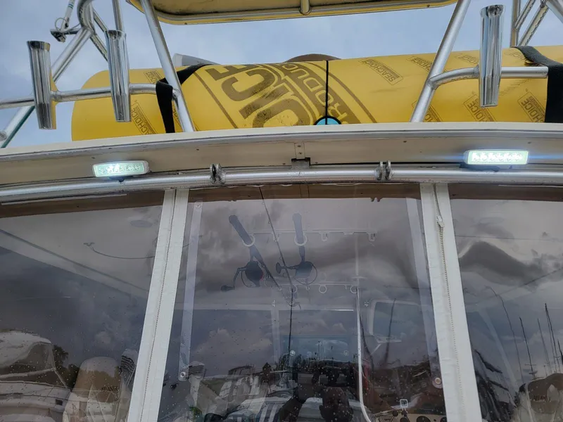 Slide: The Image of 1988 Atlantic 34 Express boat with yellow life raft. - 12